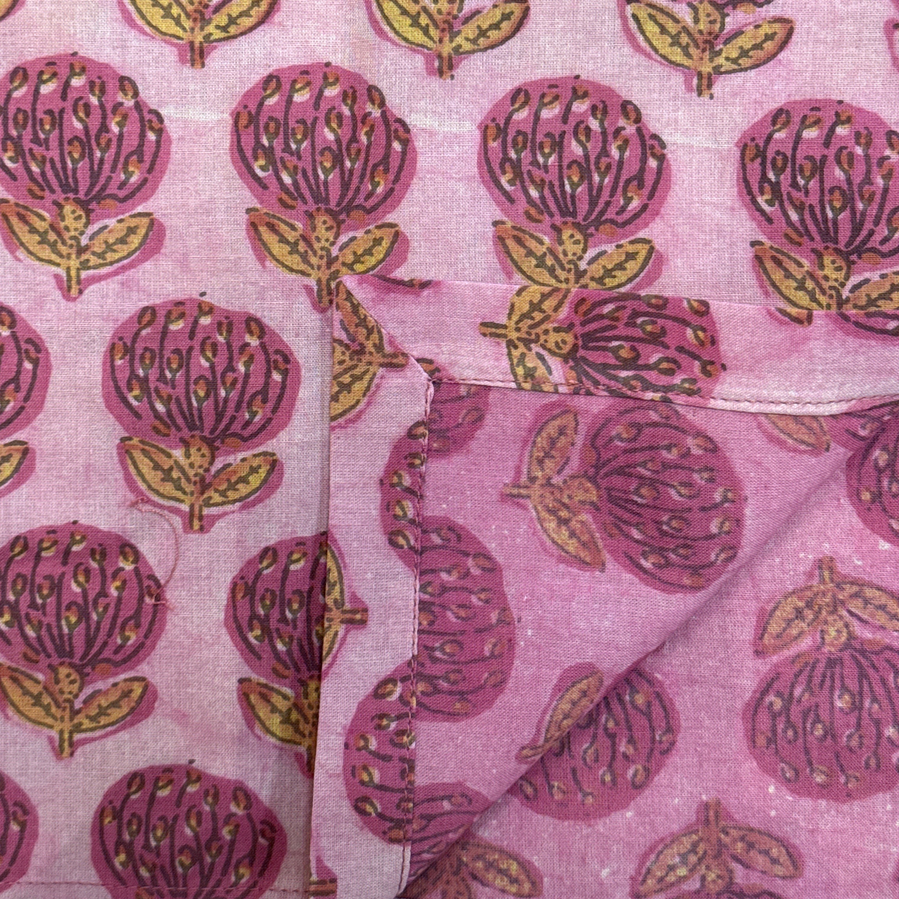 Pink fabric with purple and gold floral pattern