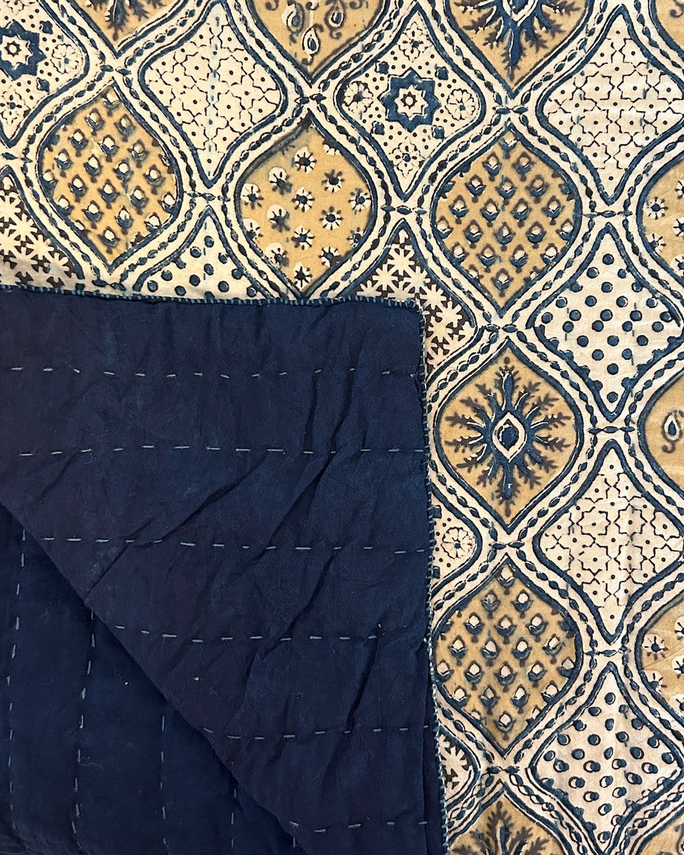detail of both sides. Handmade Natural Dyed Block Print Quilt Queen Bedspread India The design is block printed using several wooded blocks and dyed with natural dyes. Colors: mustard, charcoal and indigo blue on a cream background. 100% cotton. The back is a indigo blue color.