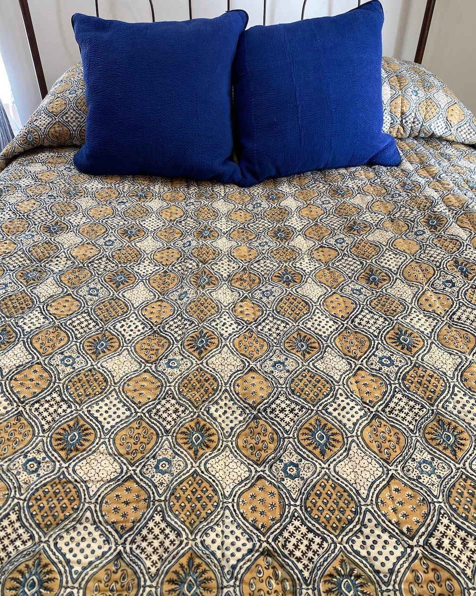 Handmade Natural Dyed Block Print Quilt Queen Bedspread India The design is block printed using several wooded blocks and dyed with natural dyes. Colors: mustard, charcoal and indigo blue on a cream background. 100% cotton. The back is a indigo blue color.