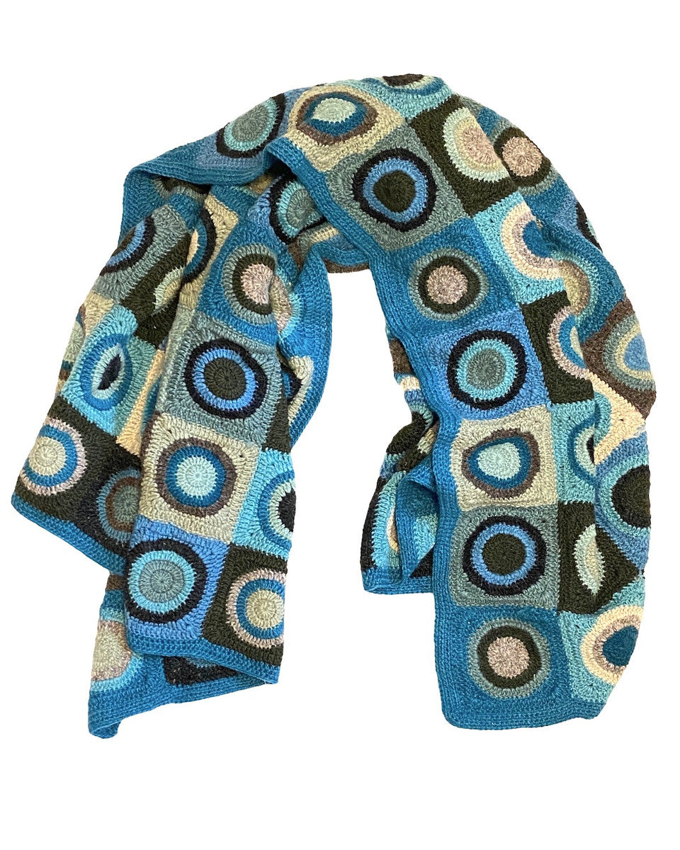 Soft wool hand crocheted throw. Purchased from a small group of artisans in Nepal. Colors: a rich medley of teal blue, pale sage, robins egg blue, deep pine, dark charcoal, grey, pale teal and more.