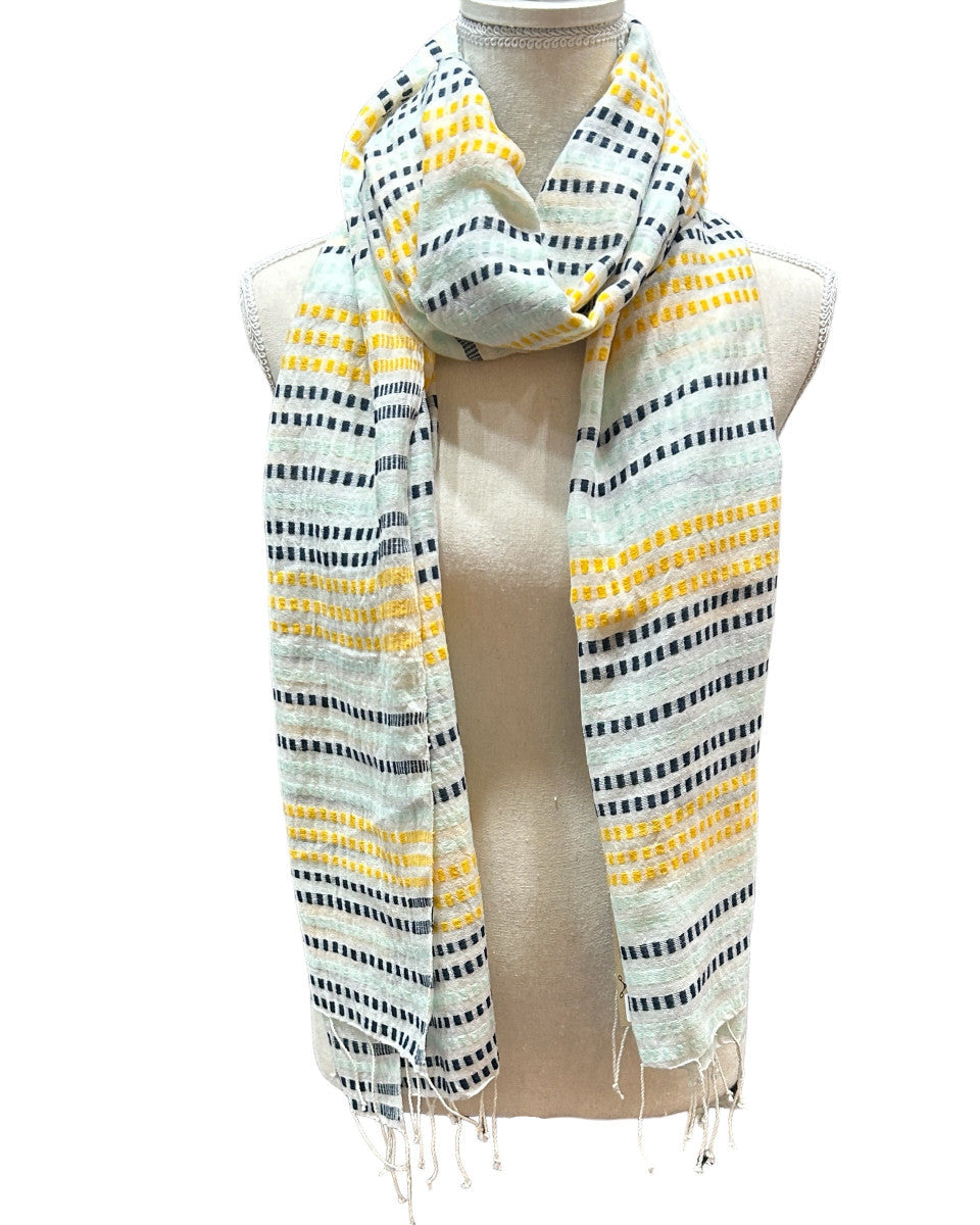Beautiful handwoven cotton scarf from the Gamo people in the southwester mountainous region of the country. This group trains women on pit looms who historically have been relegated to menial labor. This project is committed to zero waste utilizing all fragments of the process. Organically dyed, Hand wash.