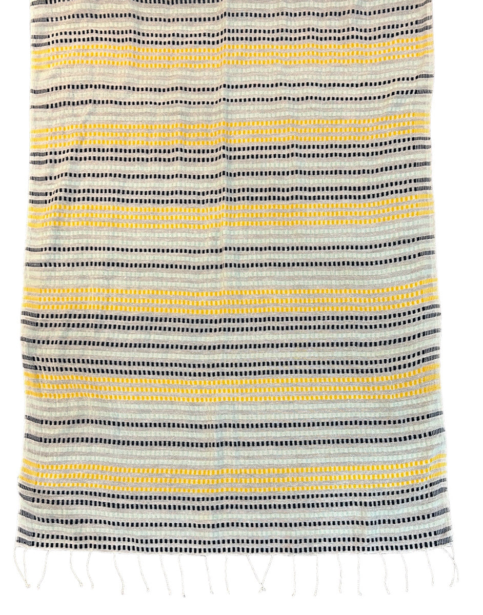 Beautiful handwoven  cotton scarf from the Gamo people in the southwester mountainous region of the country. This group trains women on pit looms who historically have been relegated to menial labor. This project is committed to zero waste utilizing all fragments of the process. Organically dyed, Hand wash.