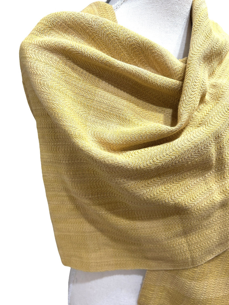 Beautiful traditional rebozo by master weavers Aurelia Jiménez and Bonifacio Pacheco of the Rebozo Mexiquense Academy in Tlahuitoltepec, Mexico. The Mexiquense Academy was founded to preserve the rebozo weaving and provide jobs to young people in his community. This finely woven rebozos (shawls or scarves), with the signature detailed twined ends, are natural dyed in shades of ochre.