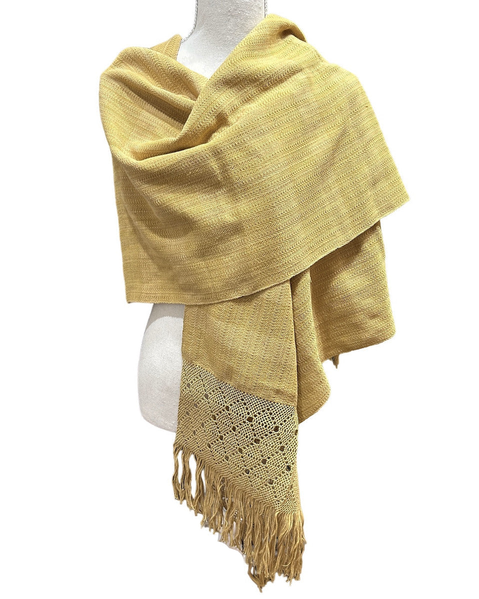 Beautiful traditional rebozo by master weavers Aurelia Jiménez and Bonifacio Pacheco of the Rebozo Mexiquense Academy in Tlahuitoltepec, Mexico. The Mexiquense Academy was founded to preserve the rebozo weaving and provide jobs to young people in his community. This finely woven rebozos (shawls or scarves), with the signature detailed twined ends, are natural dyed in shades of ochre.