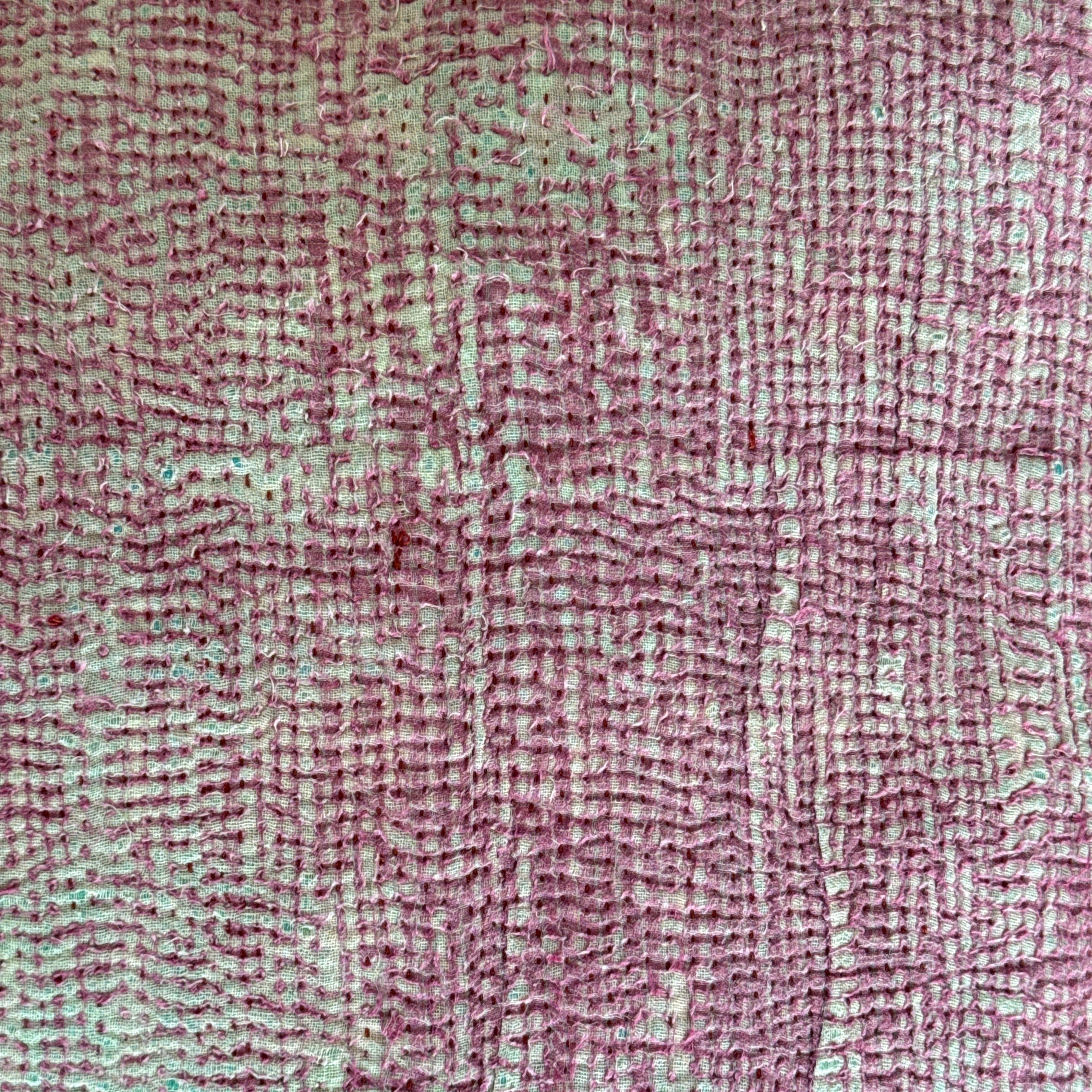 close-up of kantha pillows pink