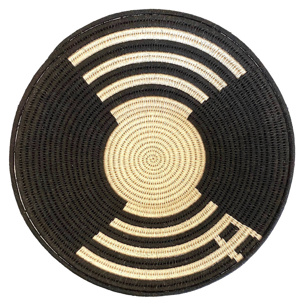 top view Handwoven fiber basket made with natural sisal from sustainably harvested sources. This is from a small artisan organization that has been working in Eswatini (Swaziland) since 1985. Very sturdy. Beautiful on the table or on the wall. Colors: cream and black.

