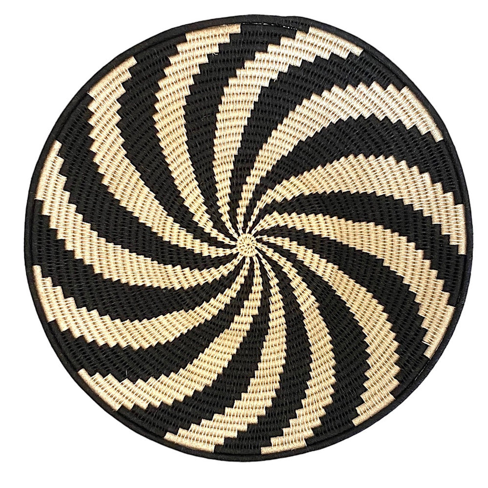 top view Handwoven fiber basket made with natural sisal from sustainably harvested sources. This is from a small artisan organization that has been working in Eswatini (Swaziland) since 1985. Very sturdy. Beautiful on the table or on the wall. Colors: cream and black.