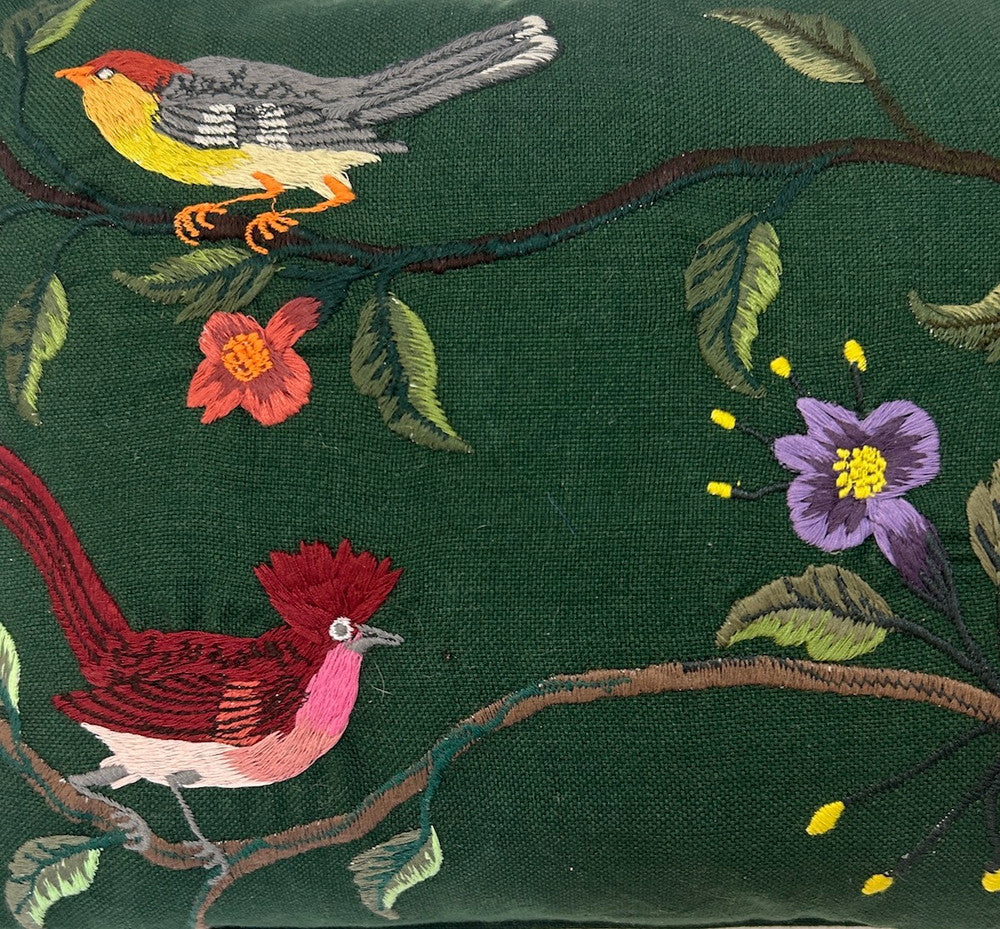 detail Handwoven cotton pillow with embroidery by Jose Sicay of Santiago Atitlan. The embroidery is done with a zigzag sewing machine. Jose is a master at free hand embroidery. The front fabric is handwoven forest green cotton . The piping and the back are the same forest green. Colors of embroidery: greens, brown, taupe, brick, sky blue, violet, yellow, grey  and more. Allow for variations in the colors as each pillow is one of a kind.