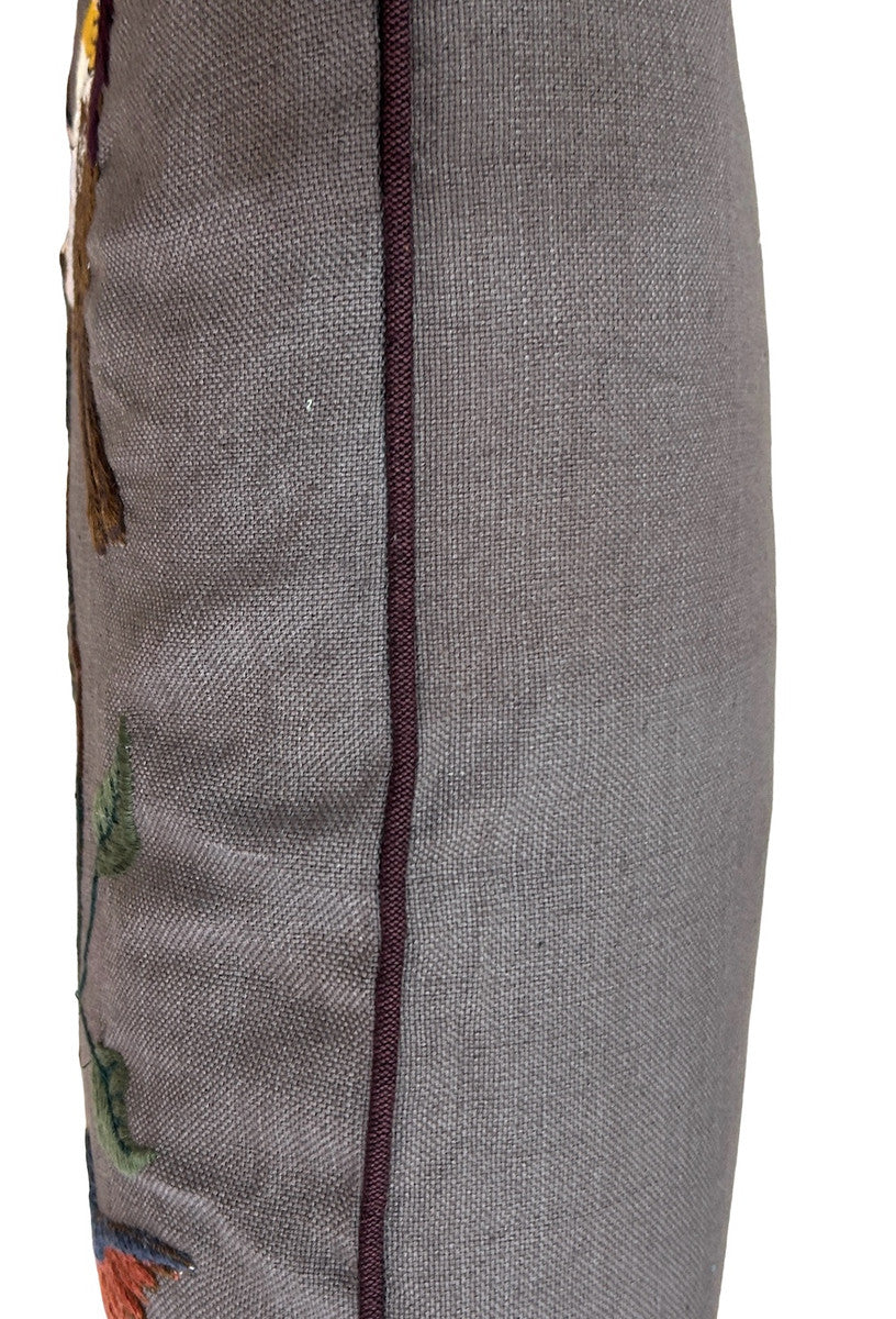side view Handwoven cotton pillow with embroidery by Jose Sicay of Santiago Atitlan. The embroidery is done with a zigzag sewing machine. Jose is a master at free hand embroidery. The front fabric is handwoven warm grey cotton . Dark brown piping and the back is the same warm grey as the front.. Colors of embroidery: greens, browns, orange, blues, gold, black and more. Allow for variations in the colors as each pillow is one of a kind. Hidden zipper with 90-10 feather/down pillow insert.