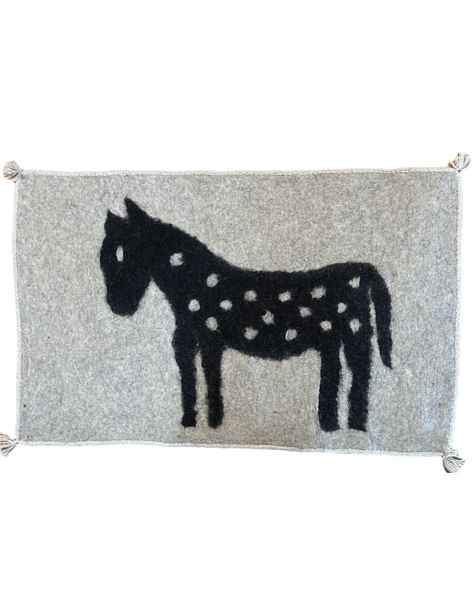 Handmade Wool Felt  Horse Rug  Afghanistan (30" x 48") Colors: natural wool fleece colors- natural heathered pale grey on heathered charcoal There is a black woven border sewn around the whole rug. These rugs are very versatile. 