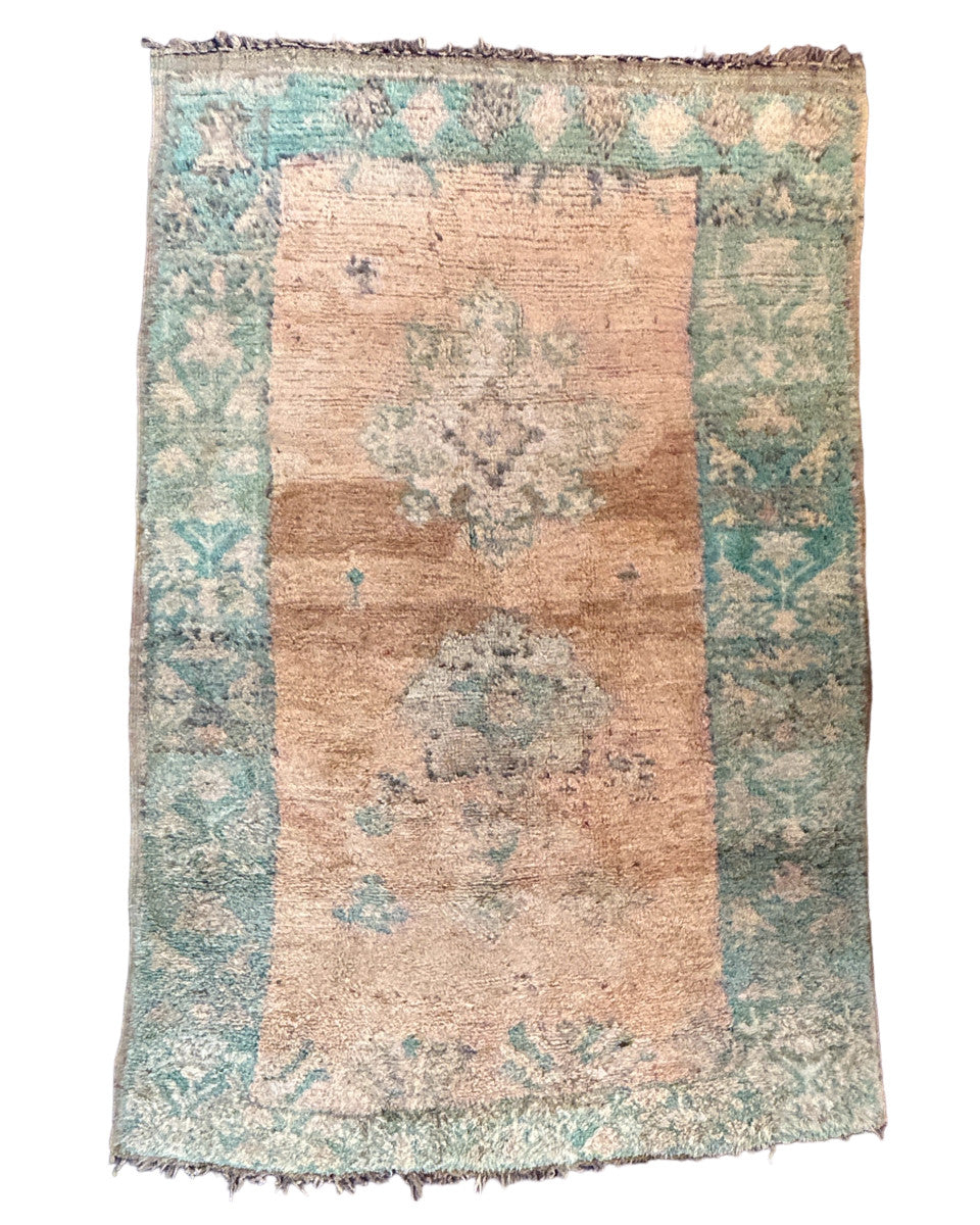Vintage “Tazenakht”style hand knotted pile rug rug in silky wool yarns. Colors are a medley of creamy peach tones, washed aqua blue, and charcoals. 

