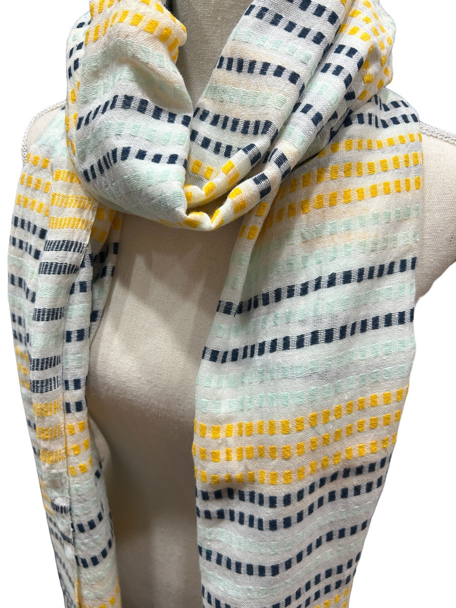 Beautiful handwoven  cotton scarf from the Gamo people in the southwester mountainous region of the country. This group trains women on pit looms who historically have been relegated to menial labor. This project is committed to zero waste utilizing all fragments of the process. Organically dyed, Hand wash. 