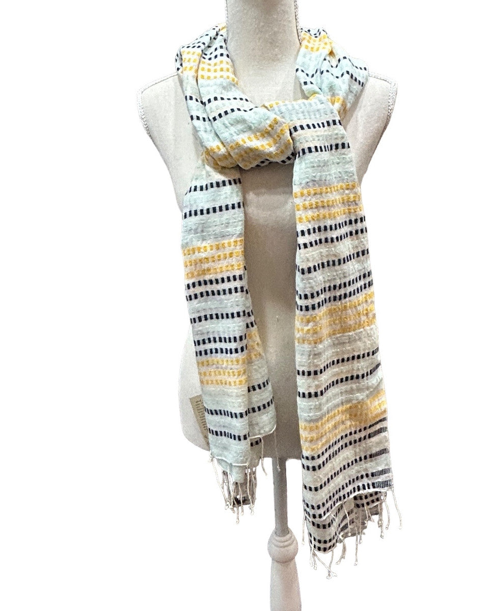 Beautiful handwoven  cotton scarf from the Gamo people in the southwester mountainous region of the country. This group trains women on pit looms who historically have been relegated to menial labor. This project is committed to zero waste utilizing all fragments of the process. Organically dyed, Hand wash. 